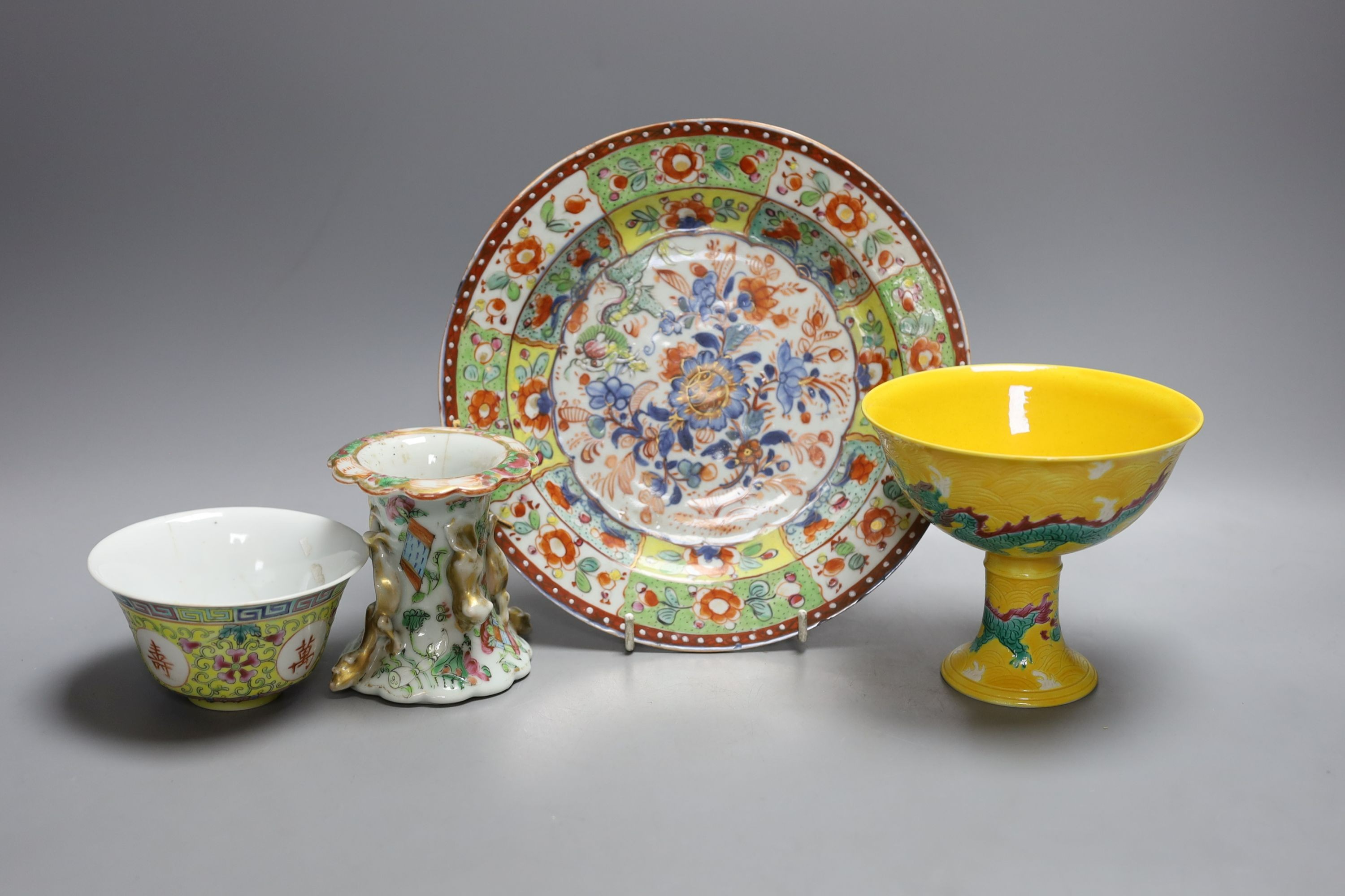 A Chinese yellow ground ‘dragon’ stem cup, a clobbered dish and two other pieces
